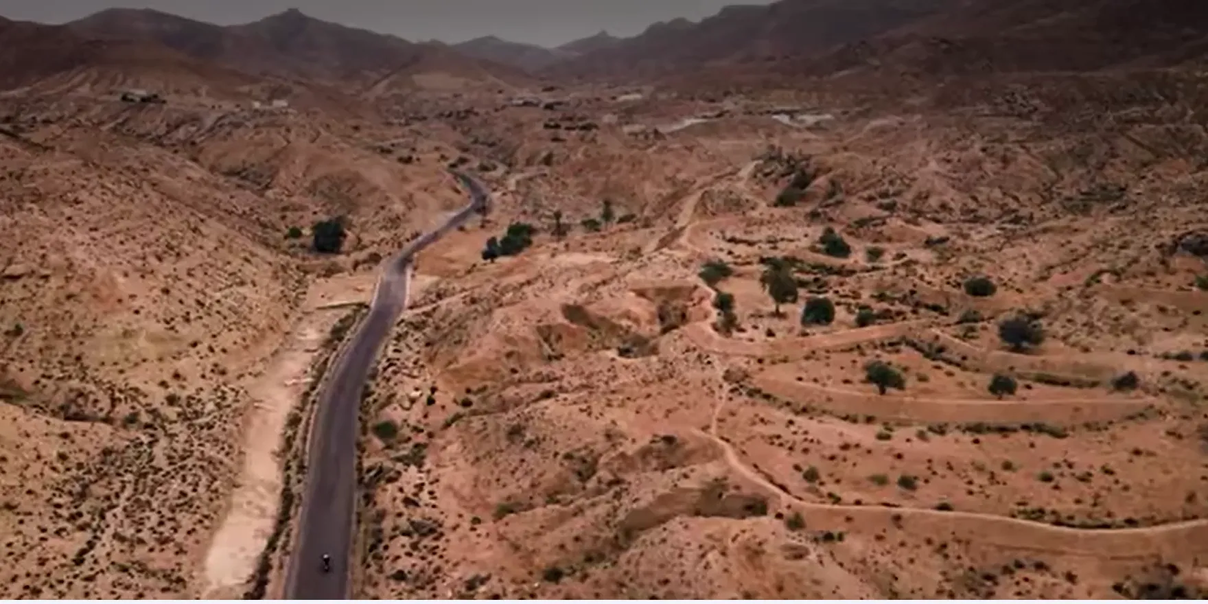 Aerial view of a road winding through the dry hills of southern Tunisia
